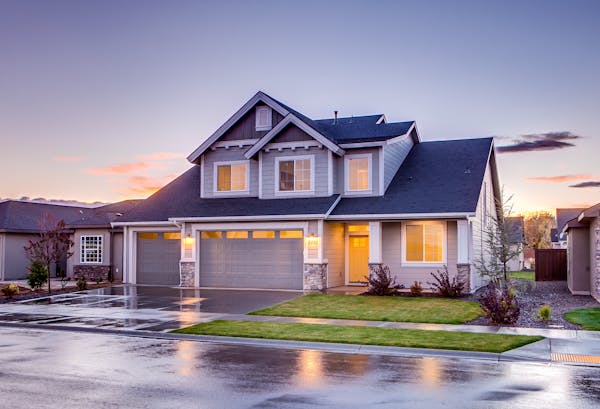 Blue and gray concrete house with attic during twilight 186077 600x409